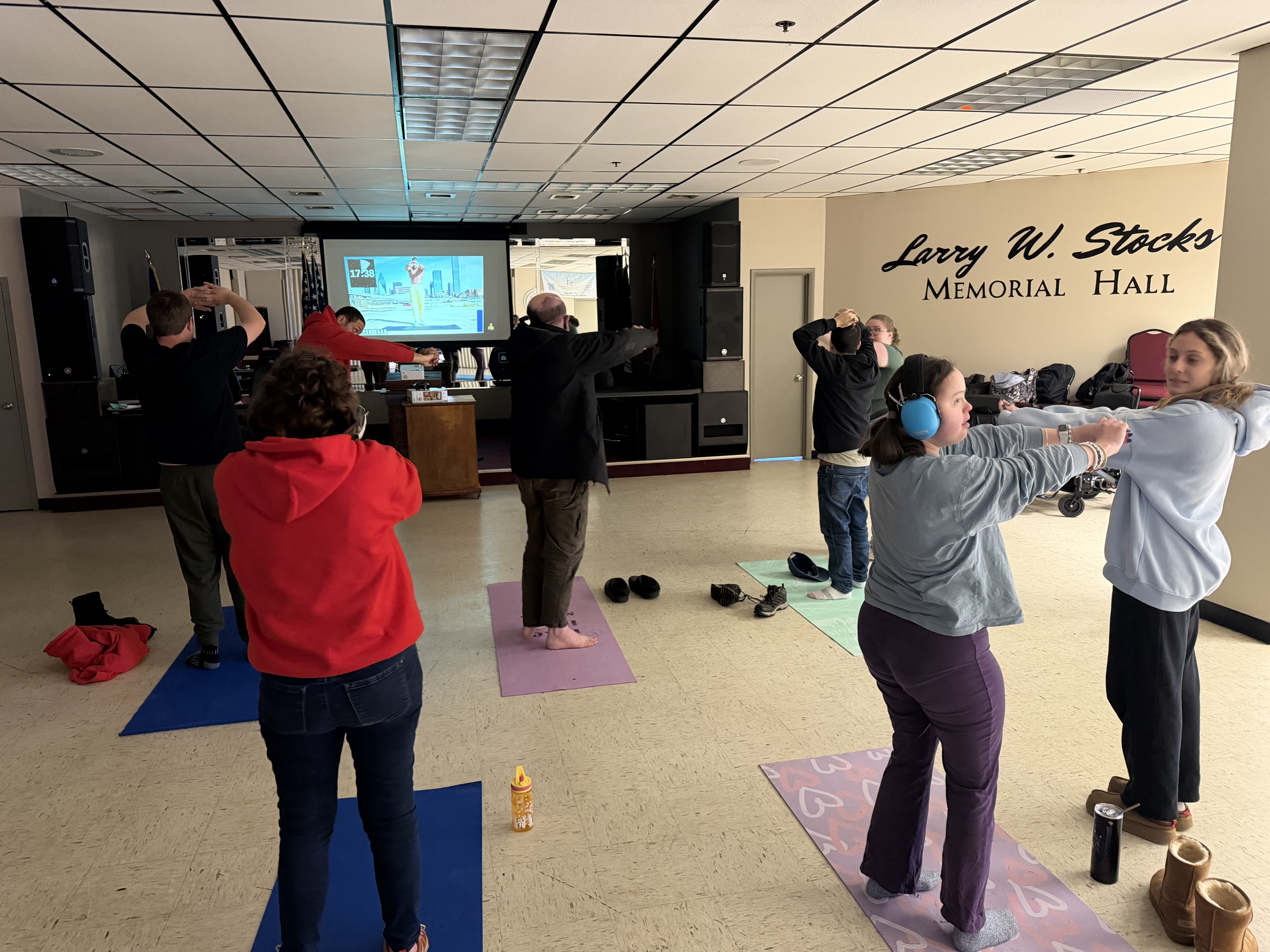 Community Safe Haven participants in a group fitness and yoga class