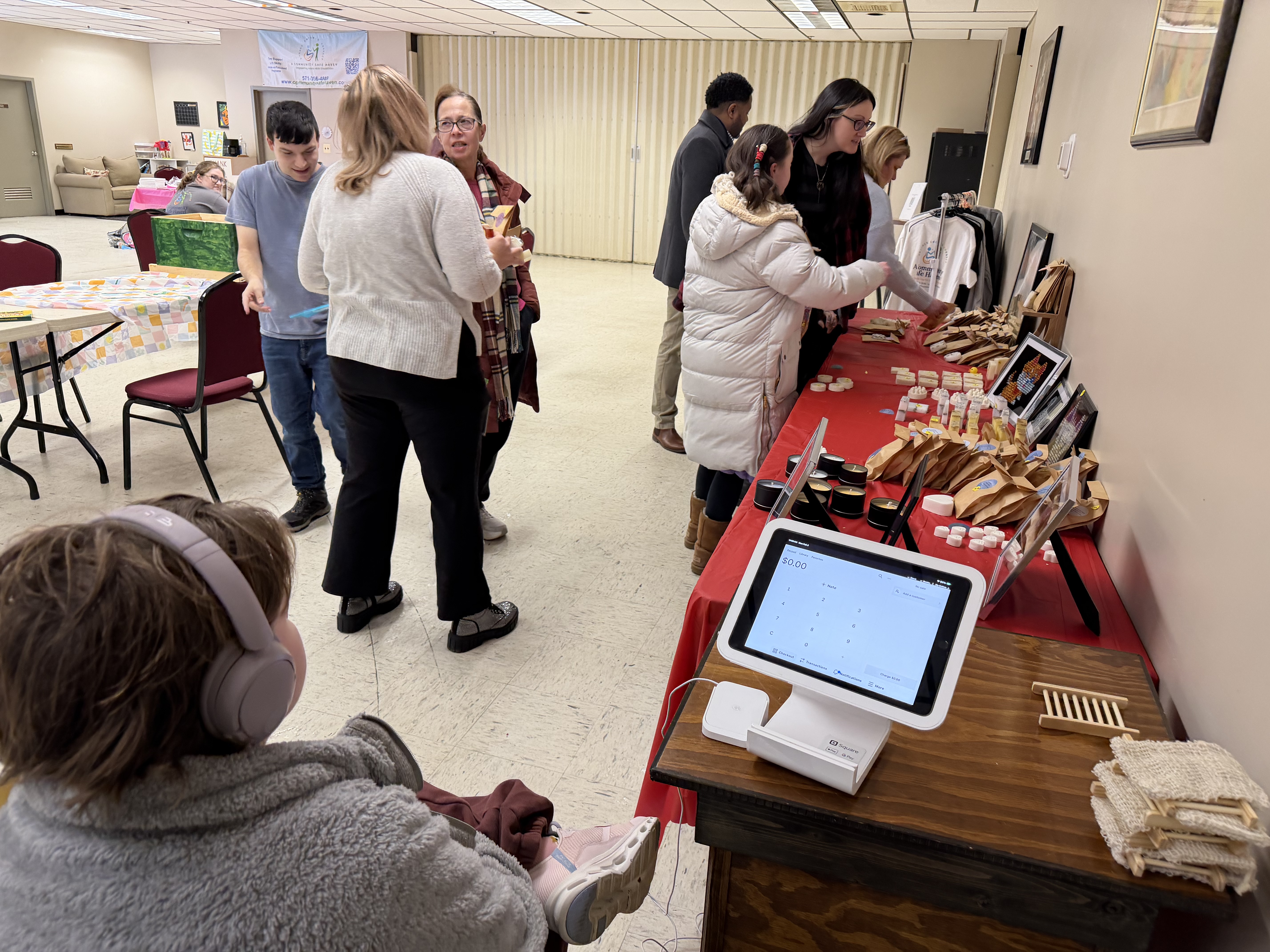 Community event with visitors and handmade goods