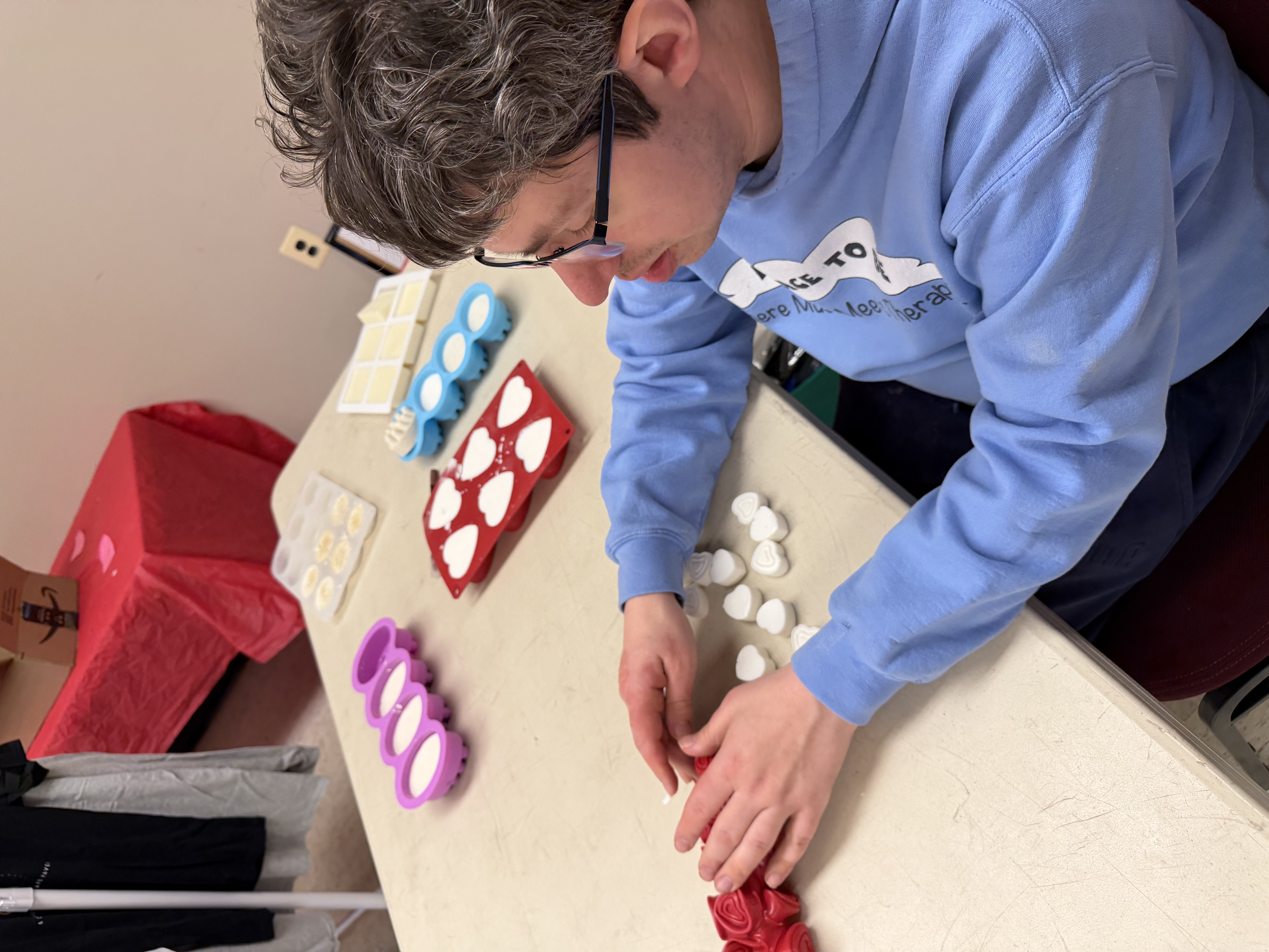 Participant making soap molds