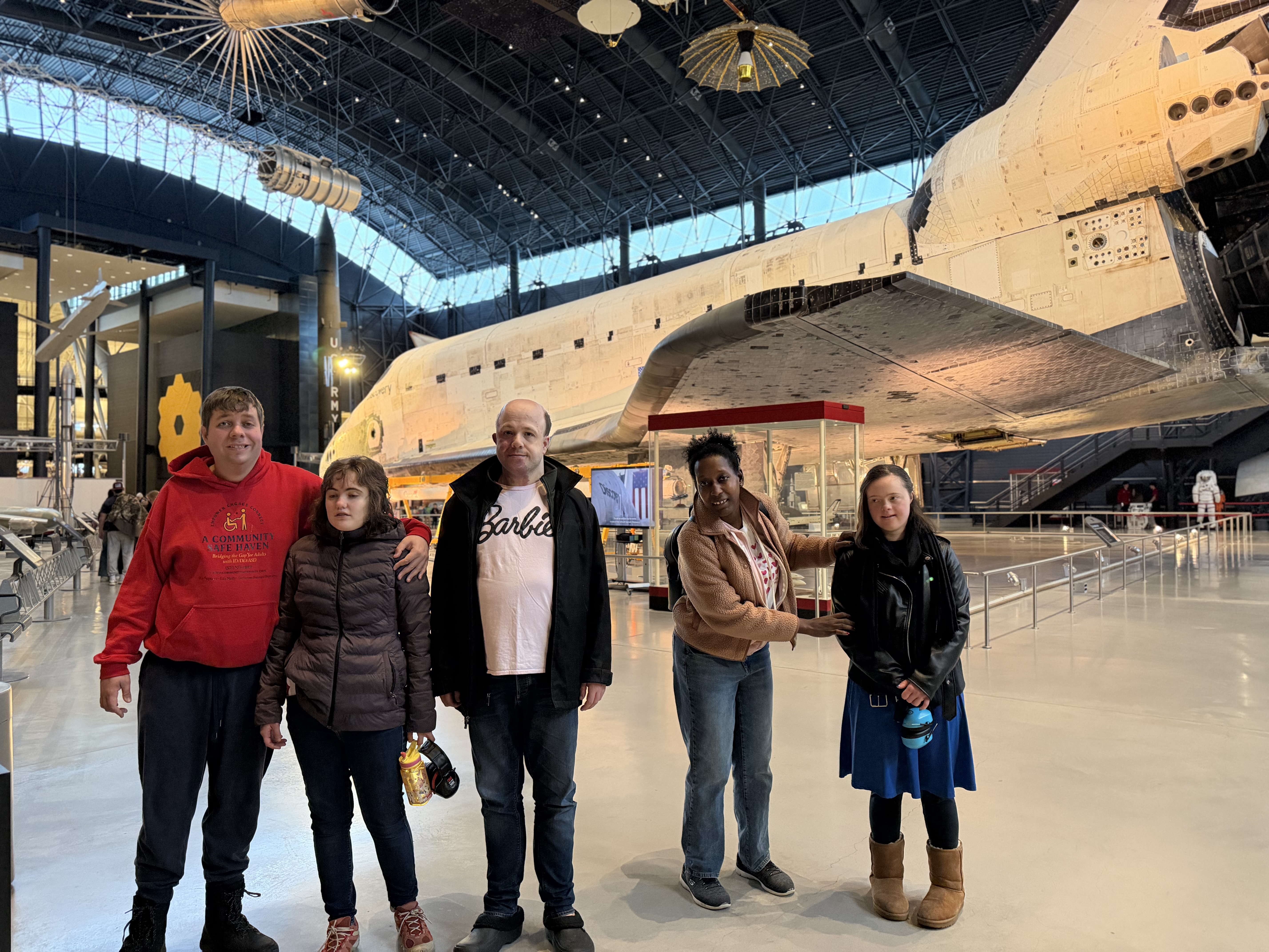Community Safe Haven participants enjoying a group outing at the Air and Space Museum