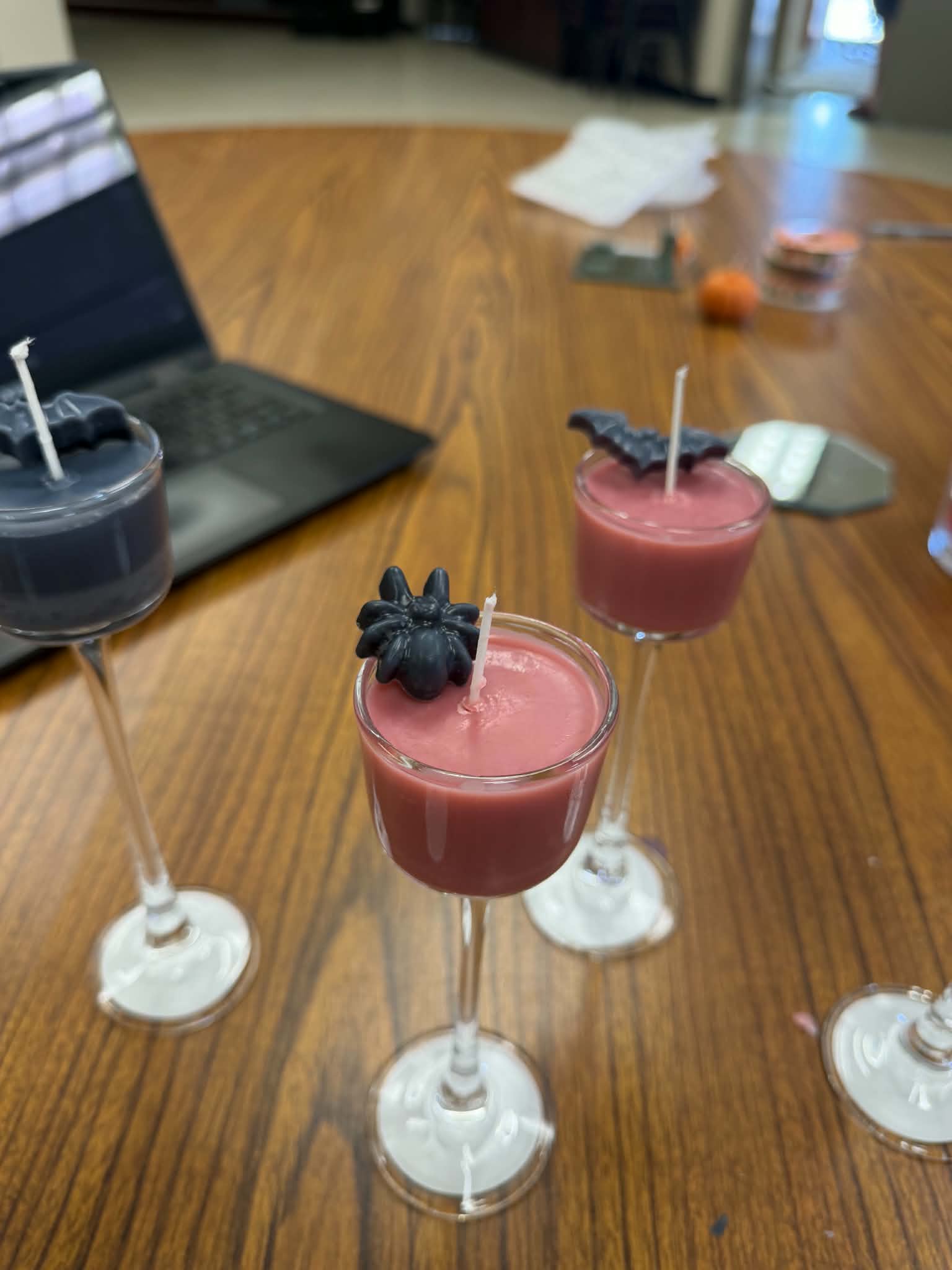 Hand-poured Halloween candles in stemmed glasses